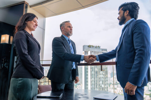 Chief executive officer with secretary meet up with business man at the rooftop balcony discuss on business investment