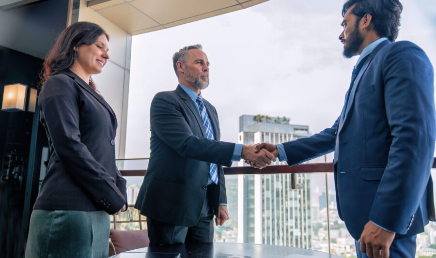 Chief executive officer with secretary meet up with business man Chief executive officer with secretary meet up with business man at the rooftop balcony discuss on business investment