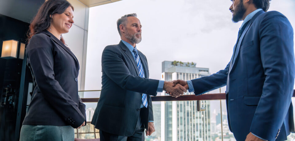 Chief executive officer with secretary meet up with business man at the rooftop balcony discuss on business investment