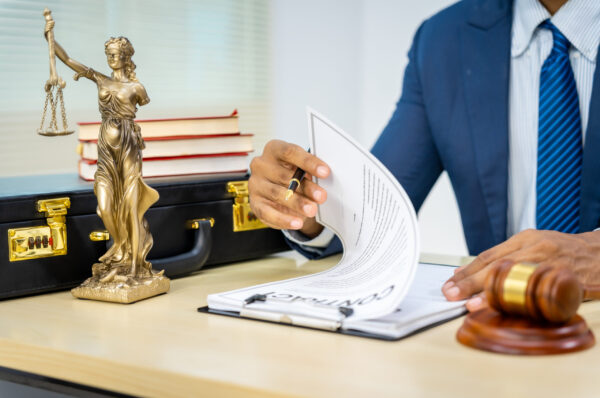 Male Asian lawyer in formal suit handles contracts, agreements, legal obligations, rights liberties