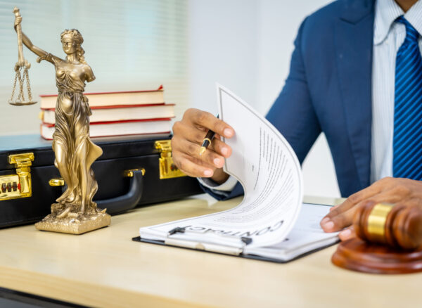 Male Asian lawyer in formal suit handles contracts, agreements, legal obligations, rights liberties