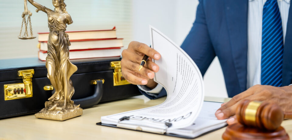 Male Asian lawyer in formal suit handles contracts, agreements, legal obligations, rights liberties